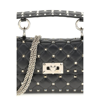 Valentino Garavani Black Calf Leather Bos Taurus Handbag with rockstud detailing and chain strap, showcasing luxury fashion.