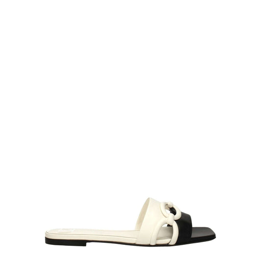 Valentino Garavani Black Leather Slippers with ivory accents, open toe, low flat heel, elegant casual design.