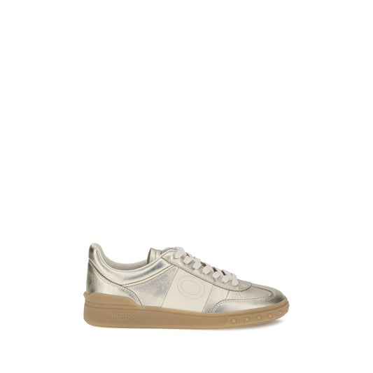 Valentino Garavani Laminated leather Upvillage Sneakers with tasseled band and studded rubber sole, AW25 collection.