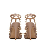 Back view of Valentino Garavani Rockstud Décolleté With 100mm Straps in powder pink leather featuring gold-tone Rockstud detailing and 100mm heels.