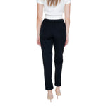Back view of woman wearing Vero Moda Black Polyester Pant, regular fit, spring/summer collection.