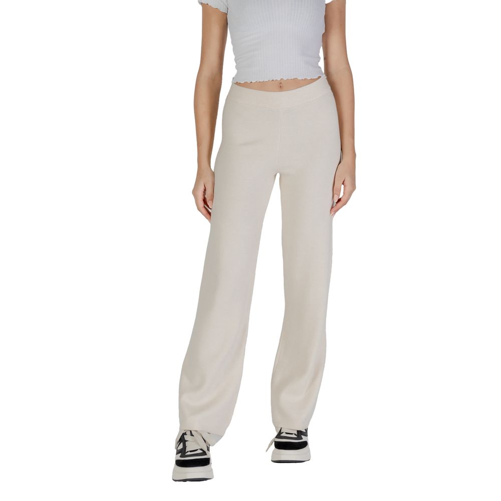 Model wearing Vero Moda Cream Viscose Casual Pants, showcasing high-quality palazzo design with a wide-leg cut and comfortable fit.