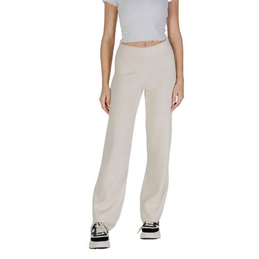 Model wearing Vero Moda Cream Viscose Casual Pants, showcasing high-quality palazzo design with a wide-leg cut and comfortable fit.