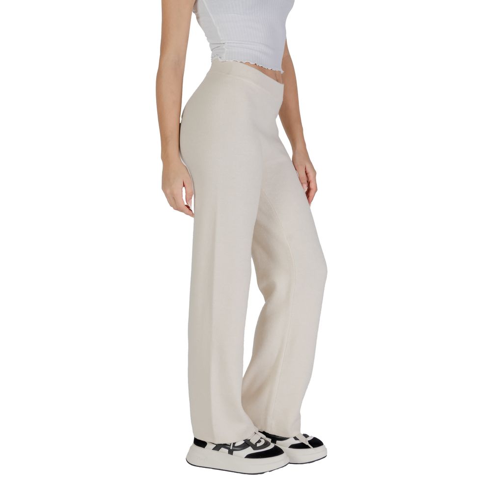 Model wearing Vero Moda Cream Viscose Casual Pants with wide-leg design for elegant and comfortable style.