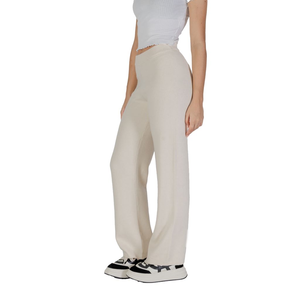 Vero Moda Cream Viscose Casual Pants worn by woman, showcasing palazzo cut and elegant style