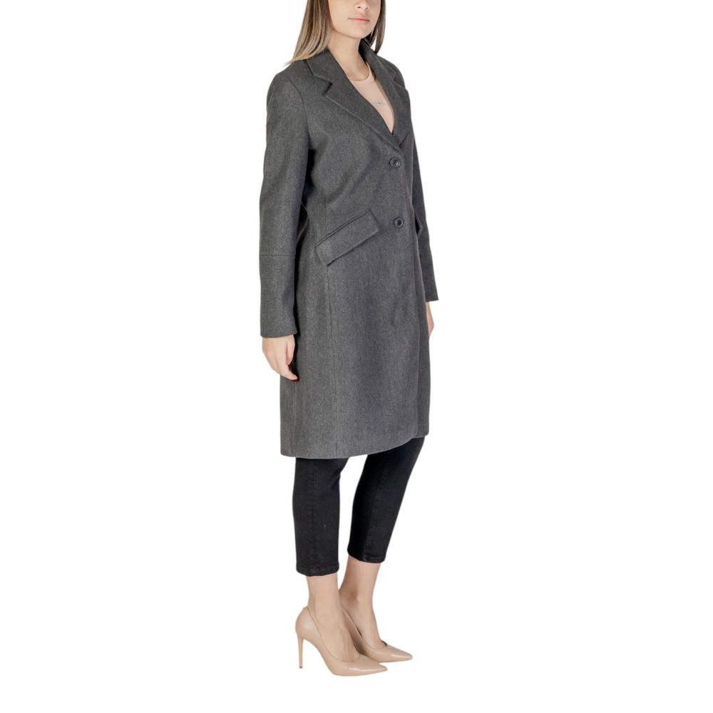 Woman wearing Vero Moda Gray Polyester Coat with lapel collar and button closure, showcasing modern style and eco-friendly design.