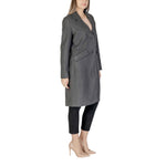 Woman wearing Vero Moda Gray Polyester Coat with lapel collar and button closure, showcasing modern style and eco-friendly design.