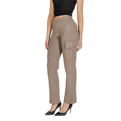 Woman wearing Vila Clothes Beige Viscose Cargo Pants with side pockets and straight-leg design.