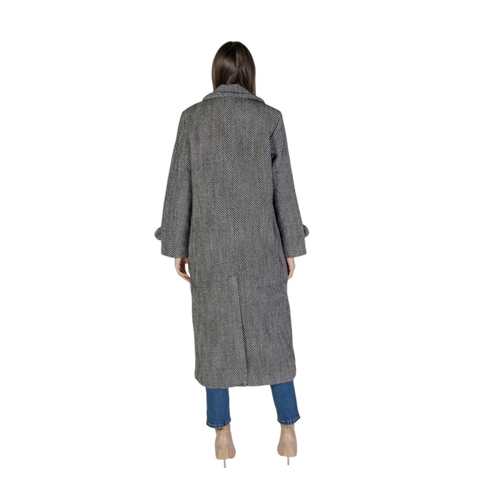 Back view of woman wearing Vila Clothes Black Polyester Coat with wide lapels and long sleeves, showcasing classic style and comfort.