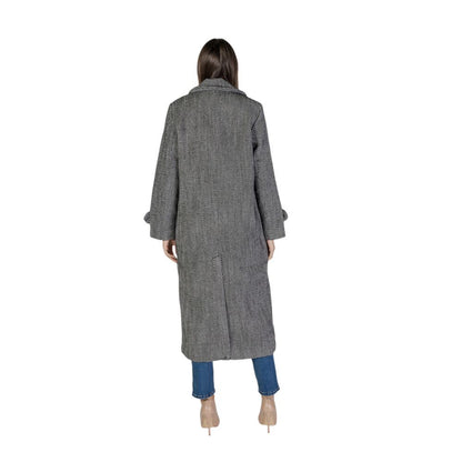 Back view of woman wearing Vila Clothes Black Polyester Coat with wide lapels and long sleeves, showcasing classic style and comfort.