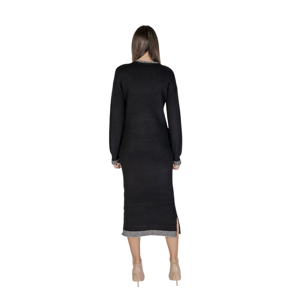 Woman wearing Vila Clothes Black Polyester Midi Dress, back view showcasing elegant bodycon fit and midi length
