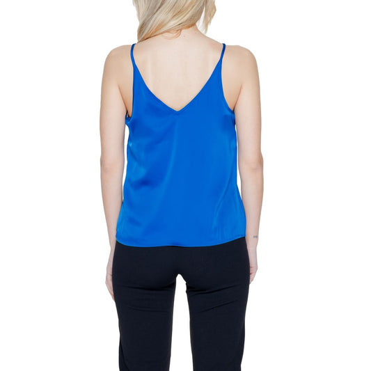 Back view of a woman wearing the Vila Clothes Blue Polyester Top with adjustable straps and a deep V-neckline, showcasing a fluid silhouette.