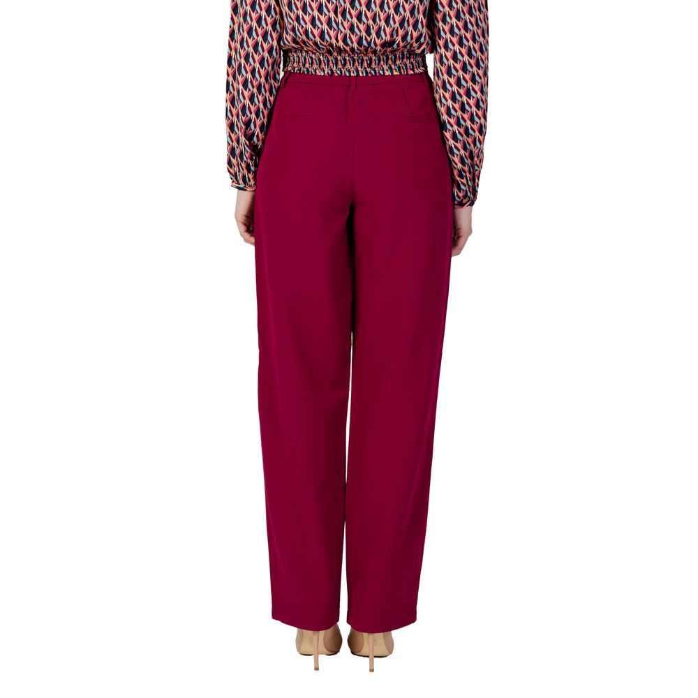 Woman wearing Vila Clothes Bordeaux Polyester Casual Pants, high-waisted wide-leg design, back view showcasing elegant fit.