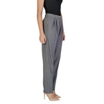 Woman wearing Vila Clothes Gray Polyester Pant with pleat design and high waist, enhancing silhouette and style.