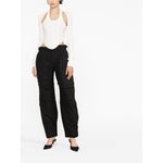 Model wearing WARDROBE.NYC WARDROBE NYC Trousers Black, cotton cargo pants with detachable legs, belt loops, and cargo pockets.