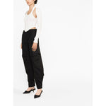 Model wearing WARDROBE.NYC WARDROBE NYC Trousers Black with detachable legs and cargo pockets