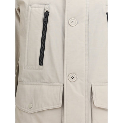Close-up of Woolrich Beige Cotton Parka with front zipper, monogram patch, and large flap pockets, ideal for AW25 season.