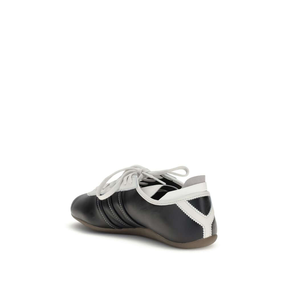 Y-3 Black Calf Leather Bos Taurus Low Top Sneakers with striped detail and lace-up closure, featuring a flat rubber sole, rear view.