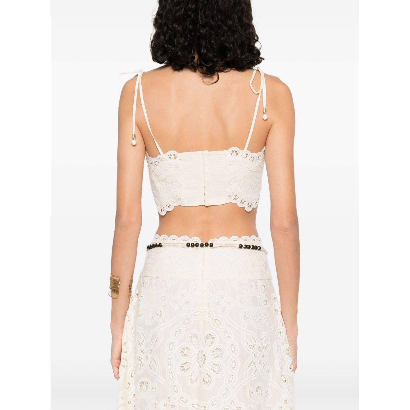 Zimmermann Cropped top featuring beige tie-fastening straps, cut-out floral detailing, and embroidered Rhiannon bodice with lettuce hem.