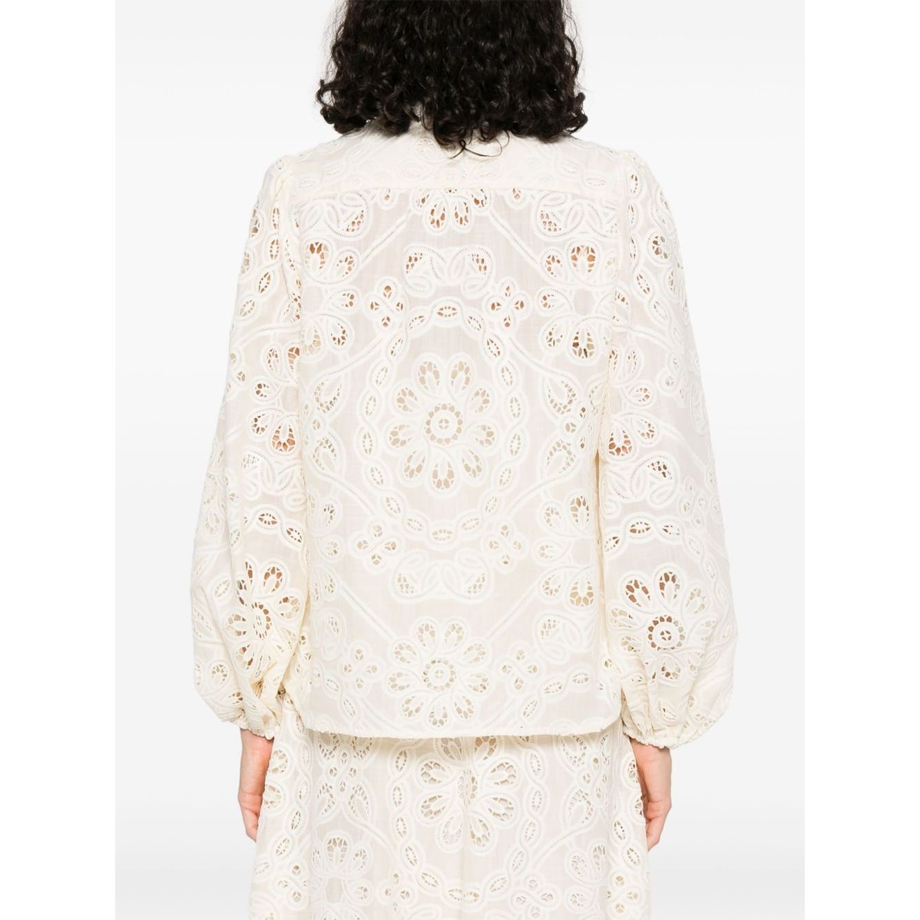 Back view of Zimmermann Shirts Ivory with cut-out floral detailing and elasticated cuffs.