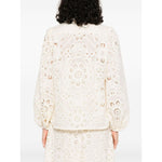 Back view of Zimmermann Shirts Ivory with cut-out floral detailing and elasticated cuffs.